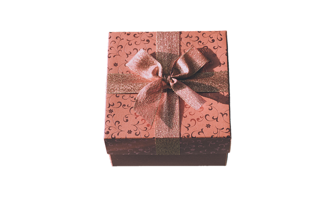 Inside the Gift Curated workshop in Scotland with beautifully wrapped gift boxes, ribbons, dried flowers and warm natural lighting on rustic wooden tables